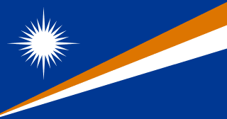 The flag of Marshall Islands has a blue field with two broadening adjacent diagonal bands of orange and white that extend from the lower hoist-side corner to the upper fly-side corner of the field. A large white star with twenty-four rays — four large rays at the cardinal points and twenty smaller rays — is situated in the upper hoist-side corner above the diagonal bands.