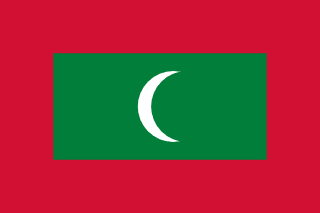 The flag of Maldives has a red field, at the center of which is a large green rectangle bearing a fly-side facing white crescent.